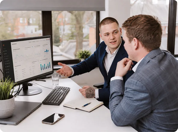 chillicommerce team reviewing an Adobe Commerce B2B store dashboard