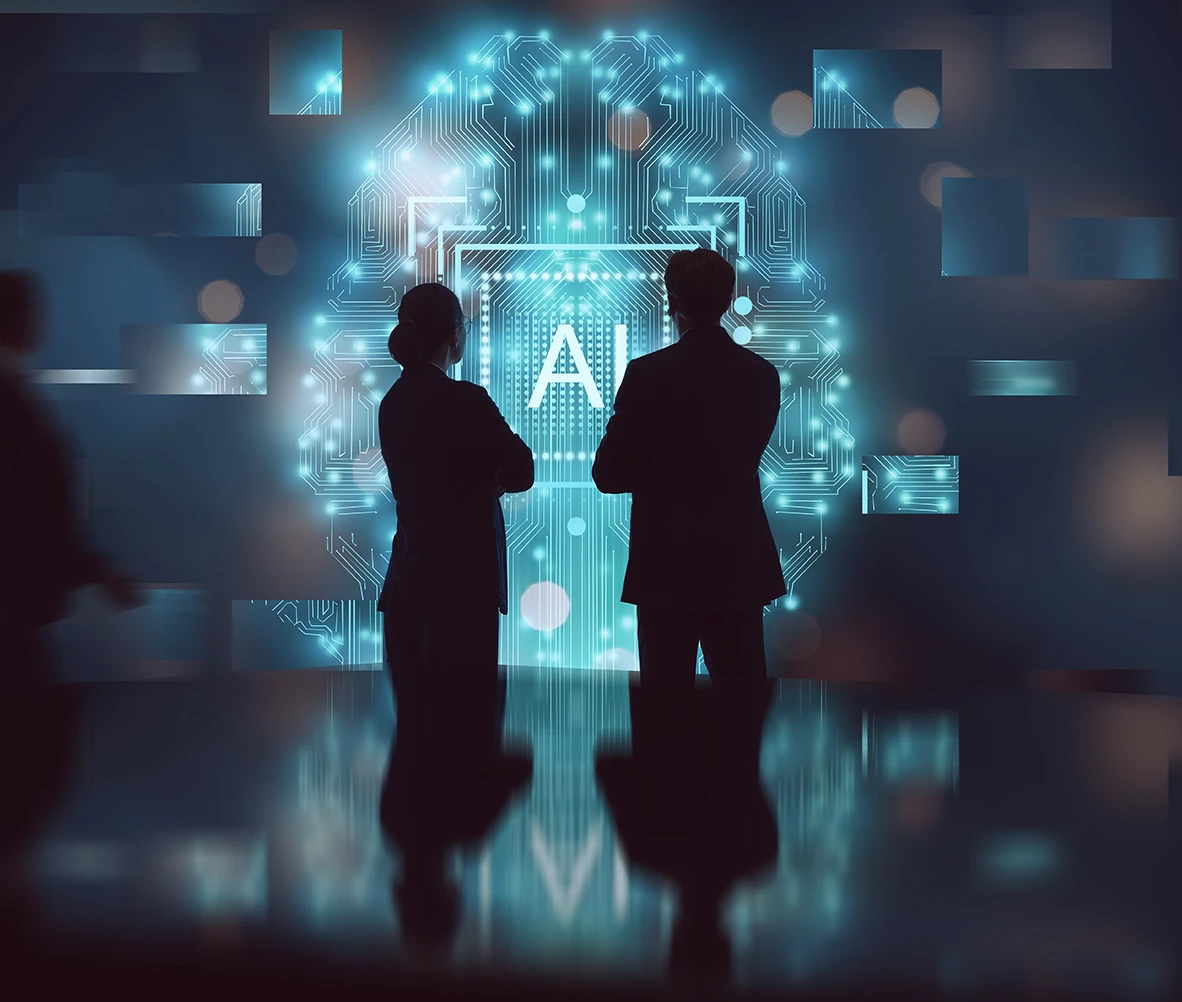 Two professionals viewing an AI-powered data visualisation representing automation for UK retail