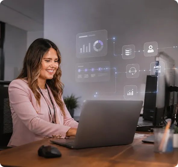 Retail team member working at a laptop with live store data surfaced by AI