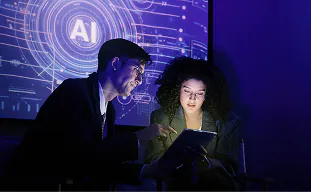 Consultants planning an AI adoption strategy in front of an AI display