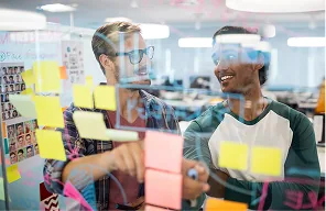 Developers shipping a working AI prototype on screen during an MVP build