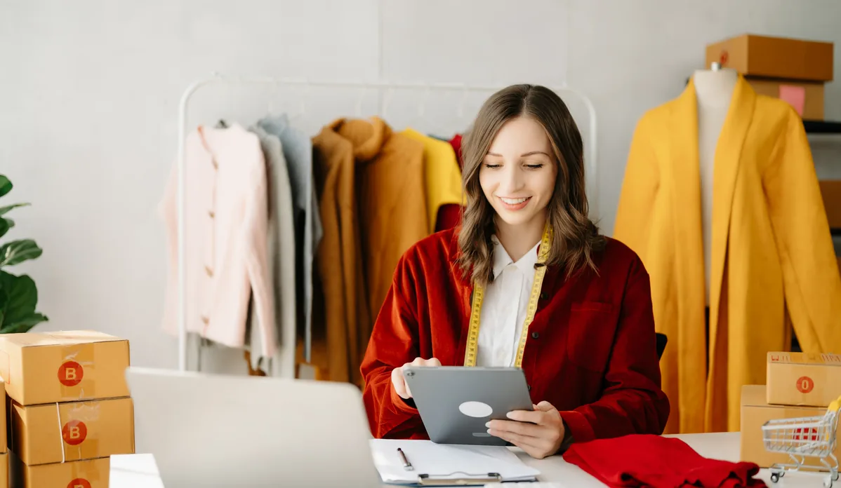 Retailer reviewing their online store on a tablet before a Magento to Shopify migration